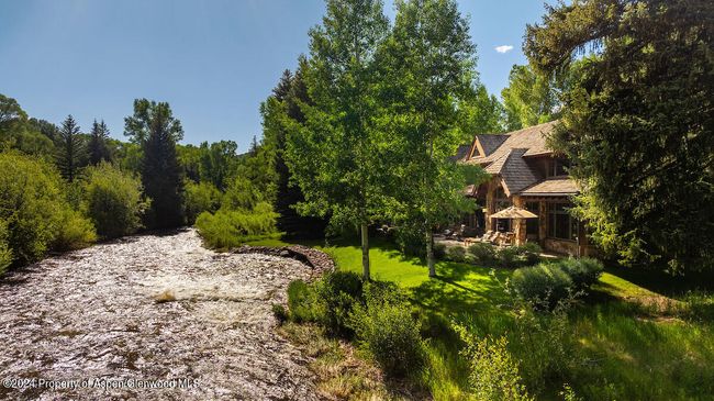 SE Elevation of Home on Lot 5, with nearly 300' of frontage. Lot 4, vacant, is down river, with 600' of river frontage. | Image 64