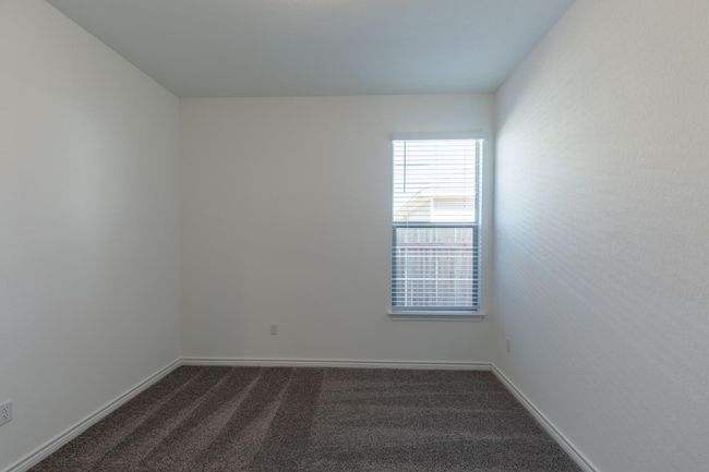 Empty room with baseboards and dark colored carpet | Image 24