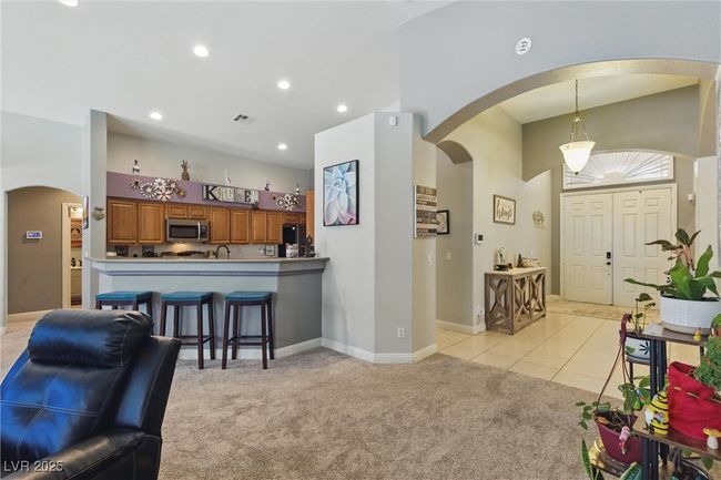 Entrance foyer with recessed lighting, arched walkways, visible vents, and light carpet | Image 16