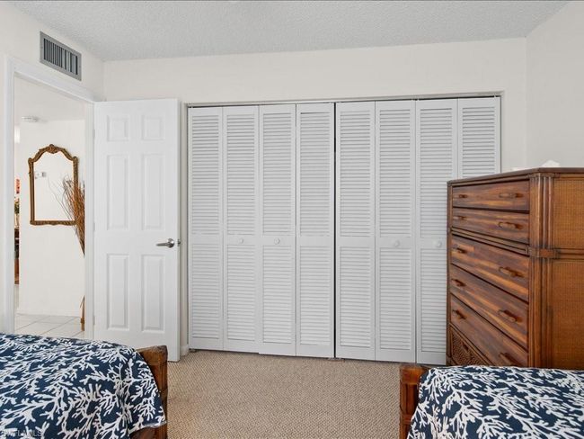 Bedroom with a closet, light colored carpet | Image 10