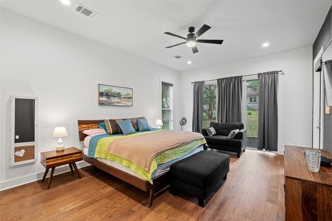 Bedroom featuring light wood finished floors, recessed lighting, access to outside, a ceiling fan, and baseboards | Image 13