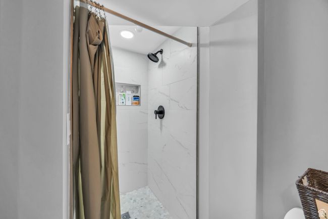 Bathroom featuring a stall shower and toilet | Image 23