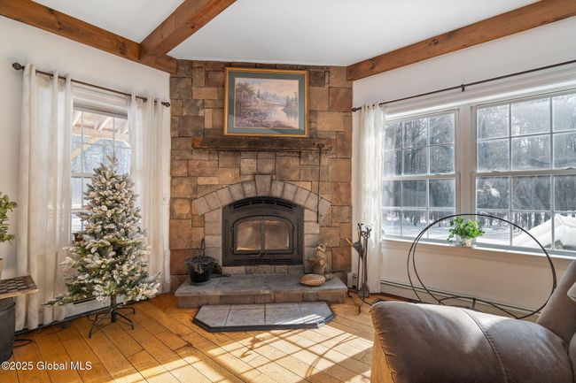 Livingroom Wood Fireplace (2014) with motor, heats up to 2500 sq ft, was previously gas powered and can easily be converted back. | Image 6
