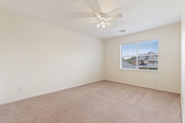 The fourth bedroom, located on the second floor. | Image 28