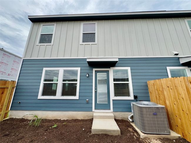 Rear view of house featuring board and batten siding | Image 5