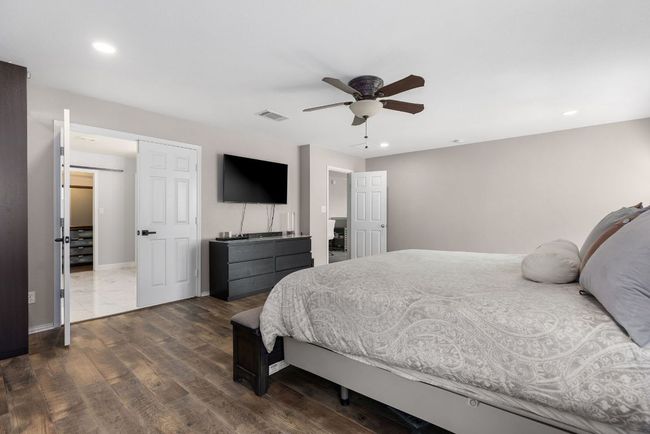 Bedroom featuring wood finished floors, recessed lighting, a ceiling fan, and baseboards | Image 22