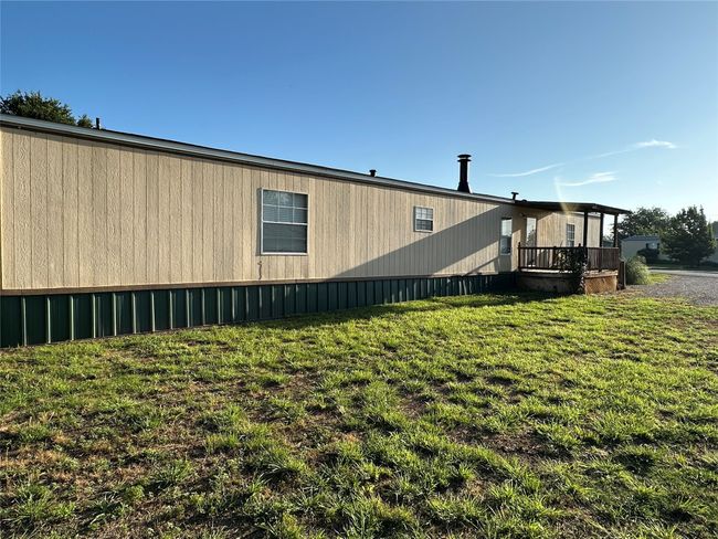 View of side of home with a yard | Image 39