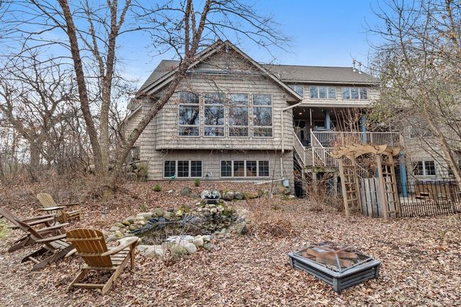 Back yard showing koi pond, sitting area and fire pit. | Image 79