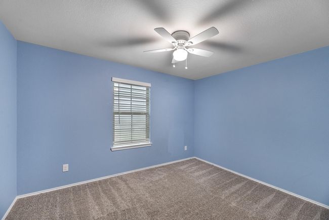 View of the front yard from the secondary bedroom. | Image 36