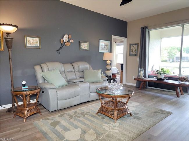 Living area with light wood-type flooring and baseboards | Image 18