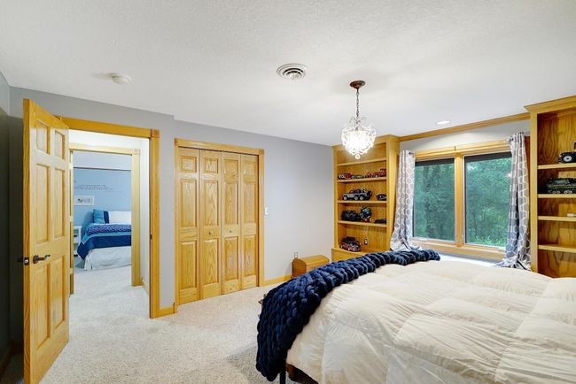Both bedrooms on this level have window seats and built-ins. | Image 33