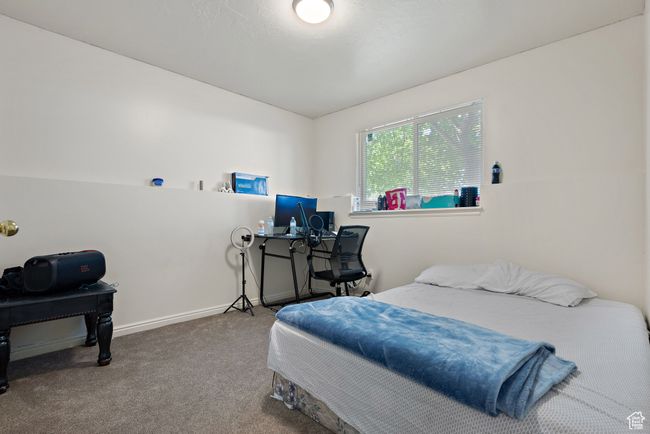 Carpeted bedroom with baseboards | Image 29