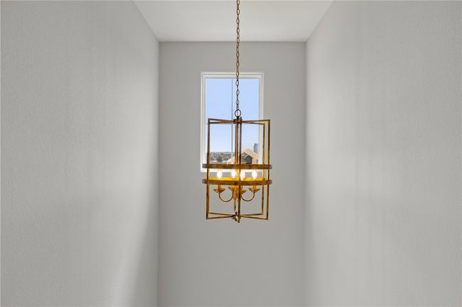 Room details with an inviting chandelier | Image 24