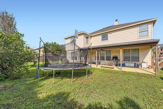 Covered Back Porch In The Large Fully Fenced Backyard | Image 27