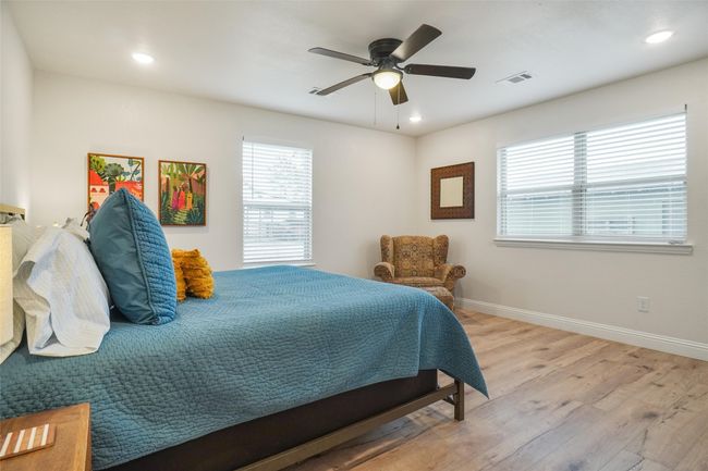 Bedroom featuring ceiling fan and light hardwood / wood-style floors | Image 16