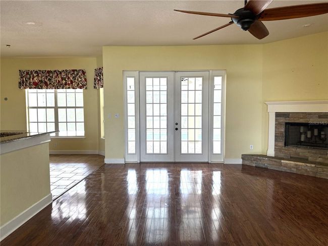Family room with fire place overlooks pool | Image 29