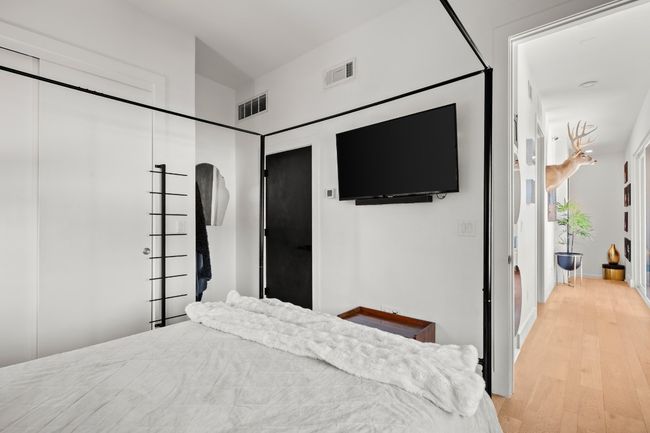 Bedroom featuring light wood-type flooring | Image 22