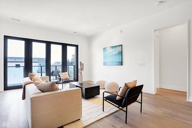 Spacious living area with 8ft window/door system which opens to your own private outdoor space and allows for natural light and great views | Image 17