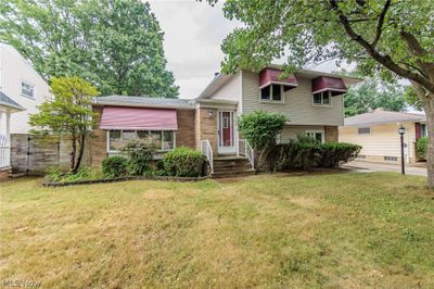 Split level home featuring a front yard | Image 2