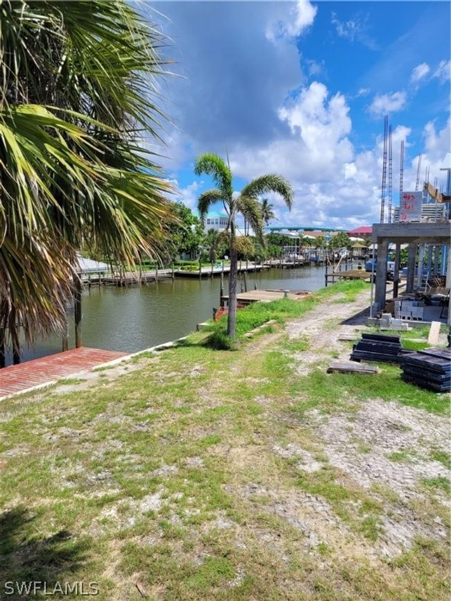 View of yard with a boat dock and a water view | Image 5