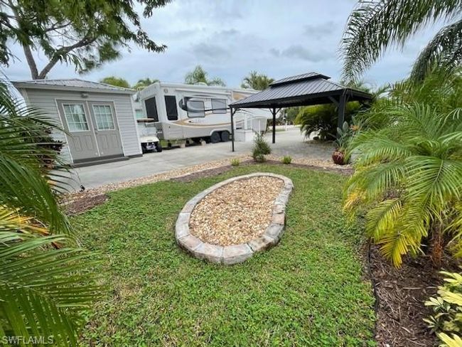View of yard featuring a patio, a gazebo, and french doors | Image 9