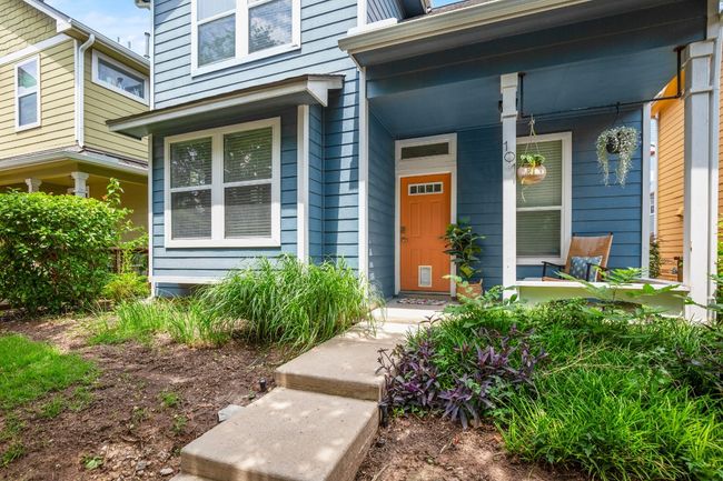 Doorway to property featuring a porch | Image 30