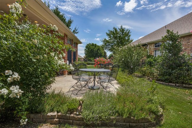 View of patio with outdoor dining area | Image 23