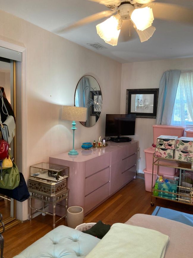 Bedroom with a ceiling fan | Image 43