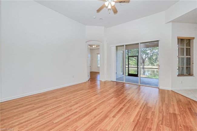 Spare room featuring ceiling fan and light wood-type flooring | Image 20