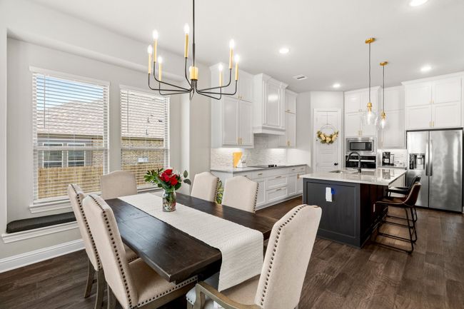 Dining space with a chandelier, dark wood-style floors, and recessed lighting | Image 14