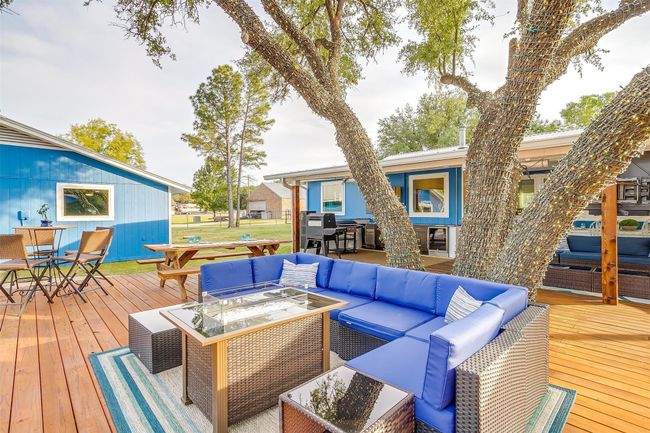 Wooden terrace with outdoor dining area and outdoor lounge area | Image 10
