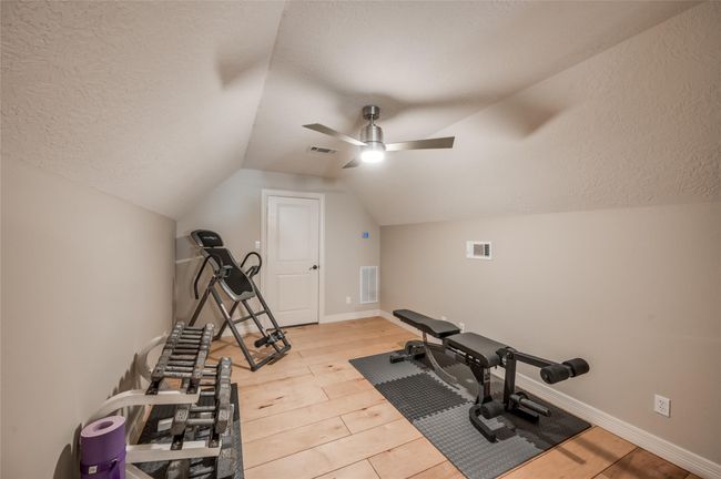 Enjoy easy access to the spacious attic through a convenient full-size doorway. | Image 27