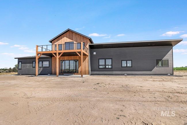 Rear view of house featuring a balcony | Image 46