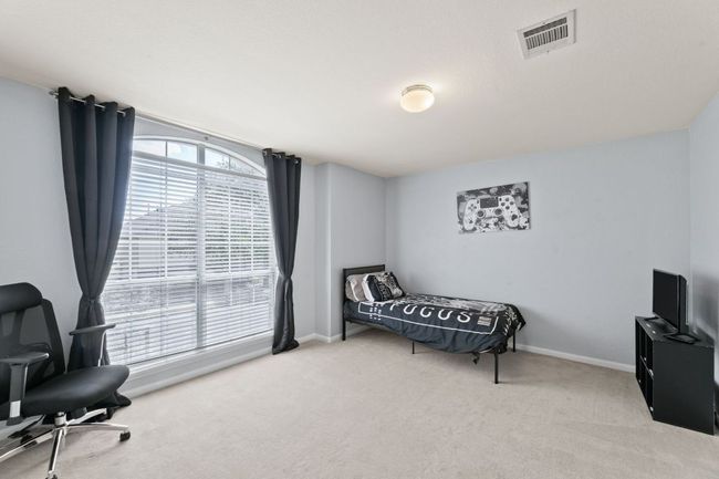 Bedroom with carpet floors and baseboards | Image 23
