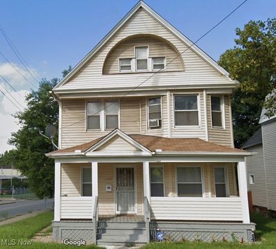 View of front of property featuring cooling unit and a porch | Image 1