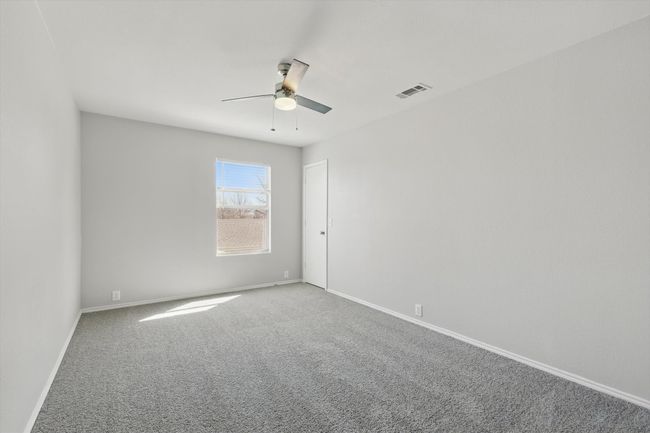 Carpeted spare room with ceiling fan and baseboards | Image 25