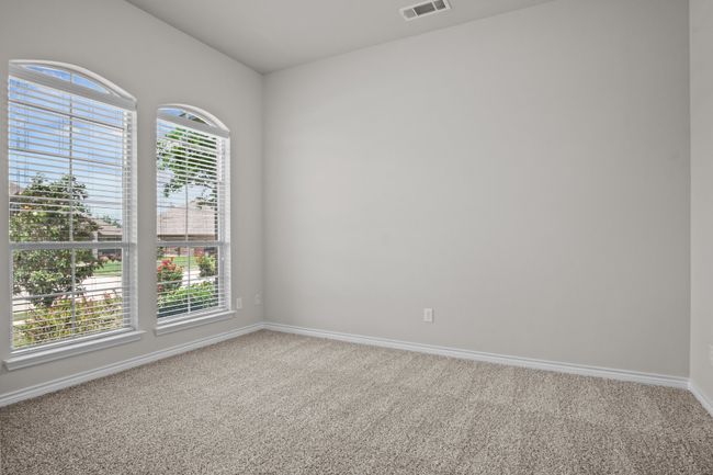Carpeted empty room featuring baseboards and visible vents | Image 17