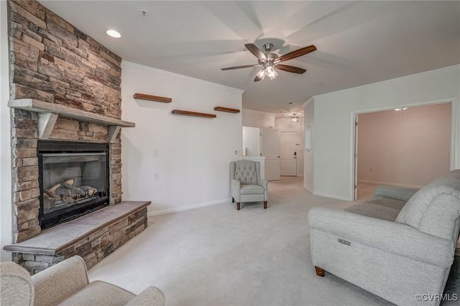 Living Room showing the gorgeous Fireplace and the entrance to the Office. | Image 4