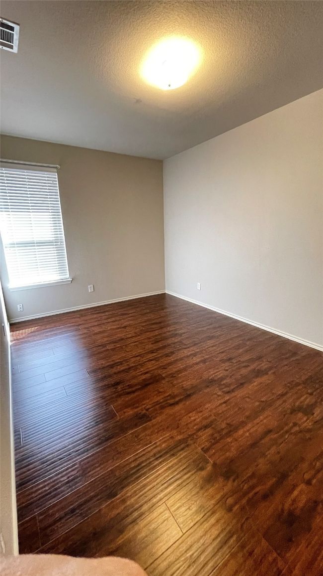 Unfurnished room featuring dark wood finished floors and baseboards | Image 24