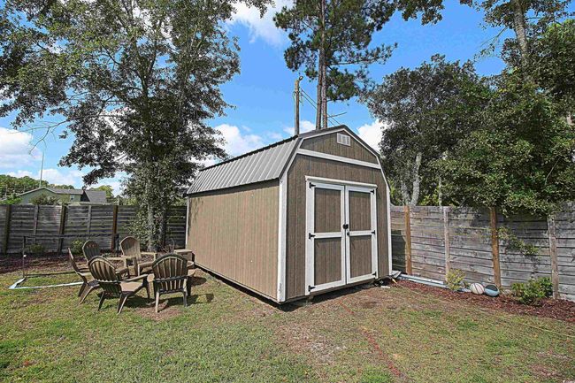 View of outdoor structure featuring a yard | Image 33