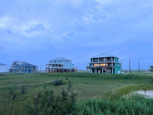 Golden hour along the Gulf paints Seahorse Estates in soft light, highlighting the cohesive charm of this boutique community. With fewer than 50 homes, each designed with quality and intention, it’s the kind of neighborhood where every detail counts—and every view delivers. | Image 15