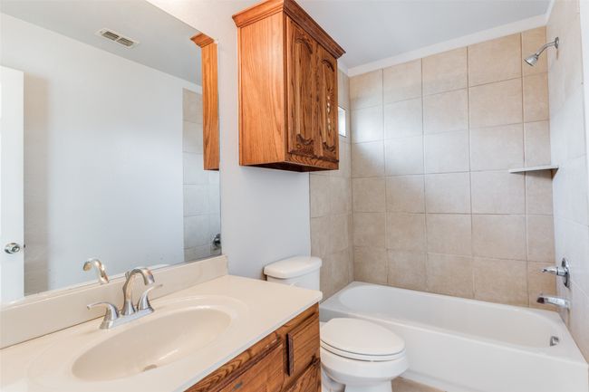 Bathroom with vanity and shower / tub combination | Image 28