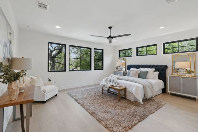 Bedroom featuring recessed lighting, light wood finished floors, ceiling fan, and baseboards | Image 14
