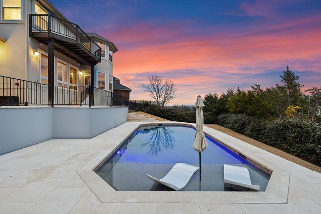 Swimming pool with a patio | Image 34