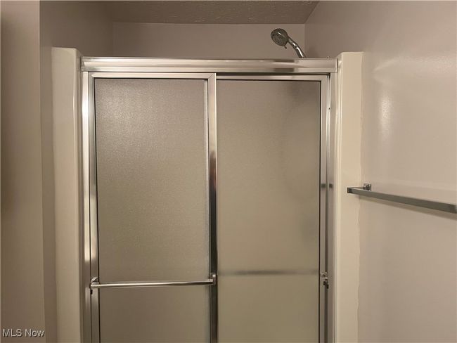 Bathroom has the convenience of an enclosed shower | Image 25