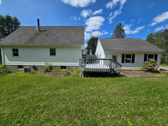 Back of property featuring a wooden deck and a yard | Image 10