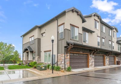 View of building exterior with a garage | Image 1