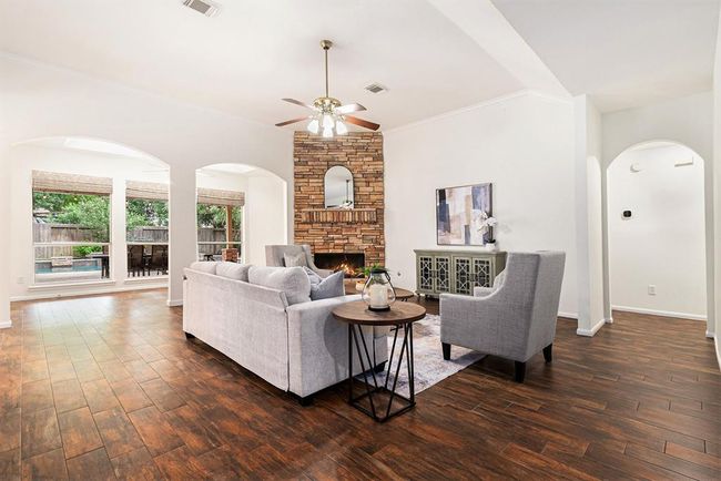 The architectural details with the arched walkways, high ceilings and views out the picture windows is just so freshening! And this home's interior has a fresh coat of paint to make it sparkle too! | Image 7