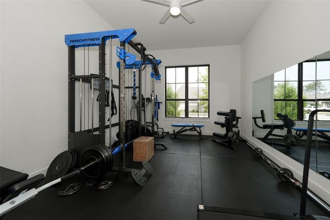 Versatile bedroom equipped as a modern home gym. | Image 32