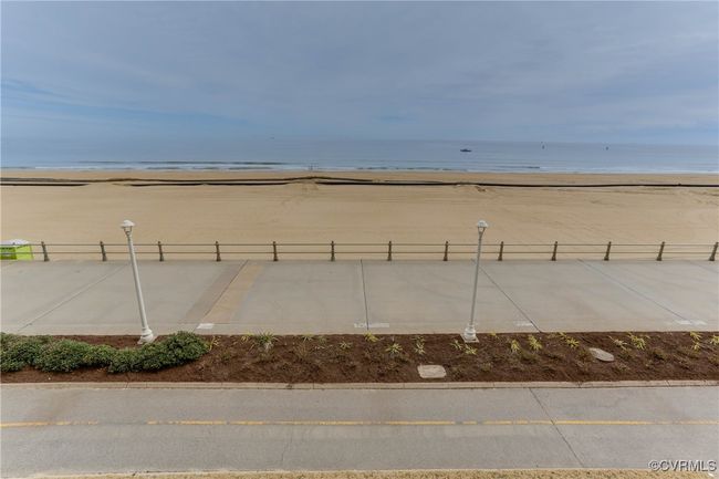View of yard with a beach view, fence, and a water view | Image 21
